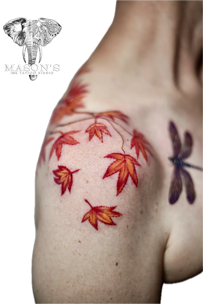 Color Leaf Tattoo Design: a minimalist tattoo of autumn leaves and a dragonfly on the shoulder