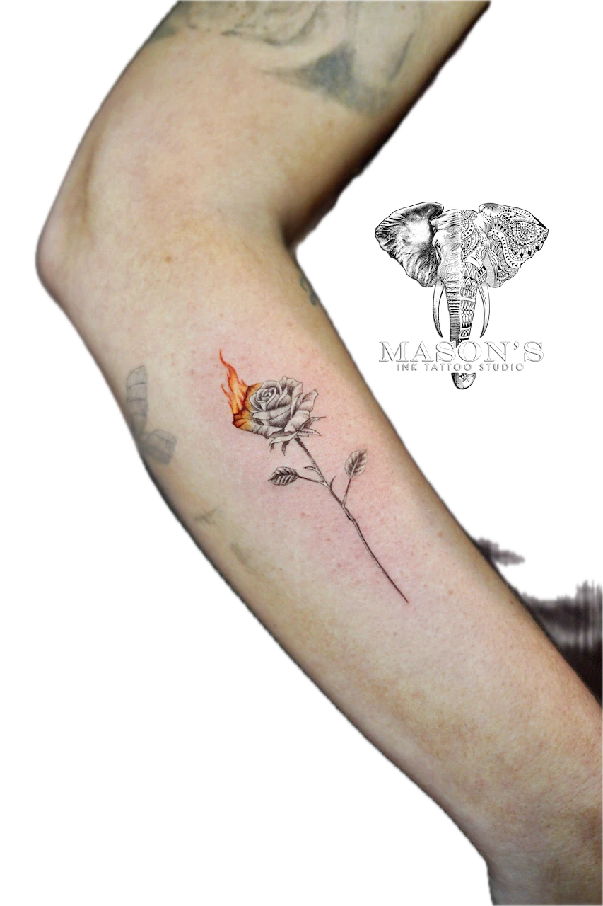 Fine Line Color Flower Tattoo Design: a small rose with a flame on the forearm
