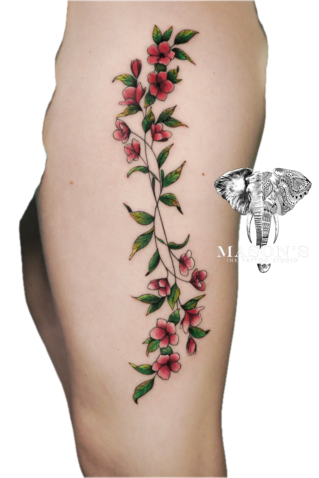 Colored Floral Tattoo Style Design: a large colourful floral vine tattoo on the thigh