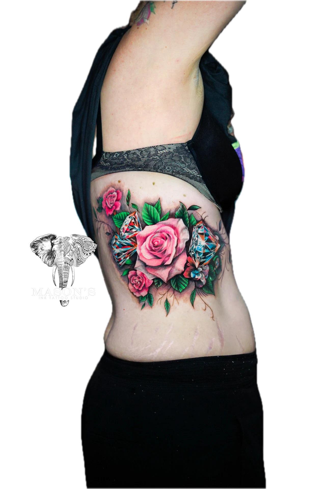 Colored Floral Tattoo Style Design: a colorful rose and butterfly tattoo on the ribs