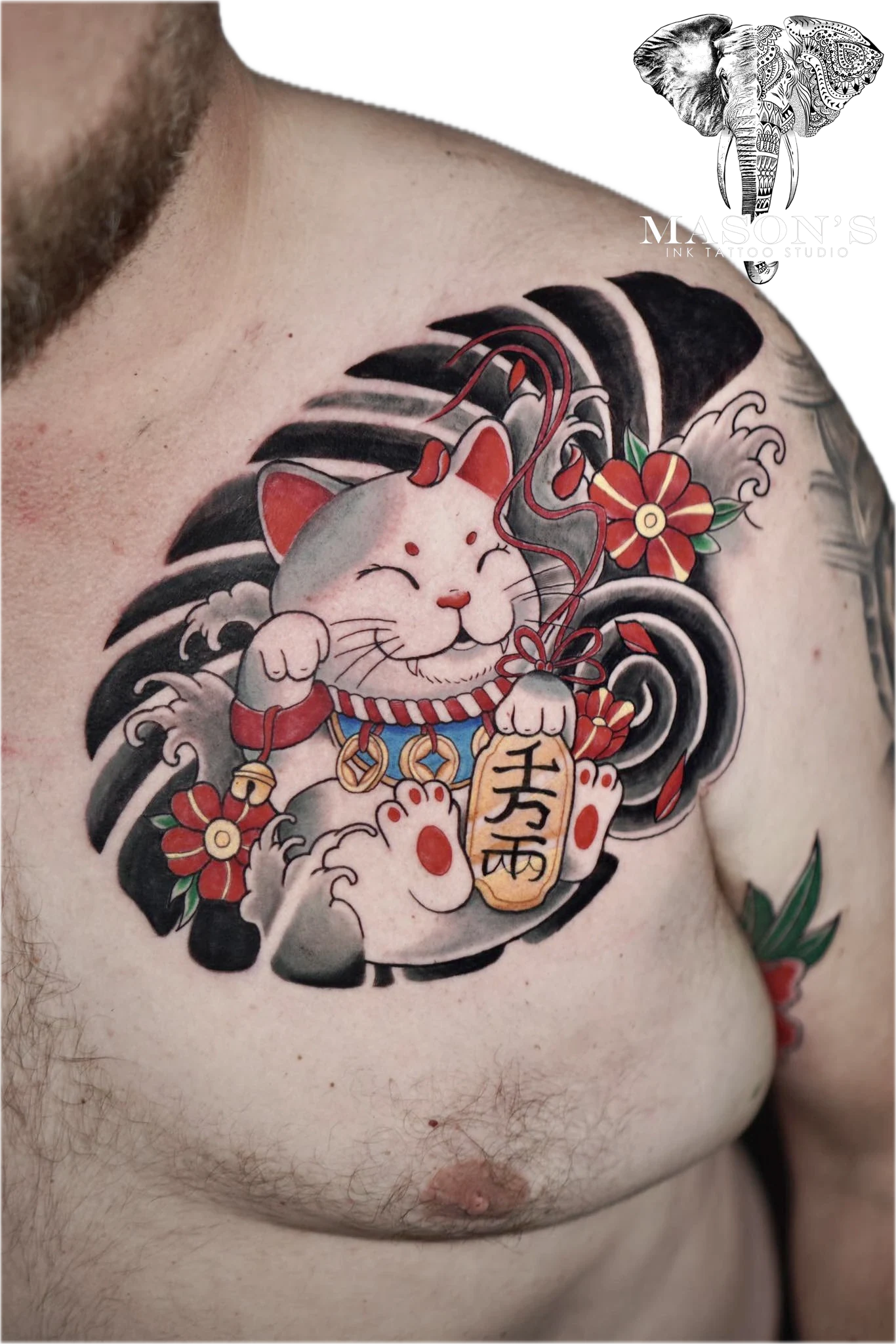 Colored Japanese Tattoo Style Beckoning Cat: a smiling cat holding a coin and flowers on a wave