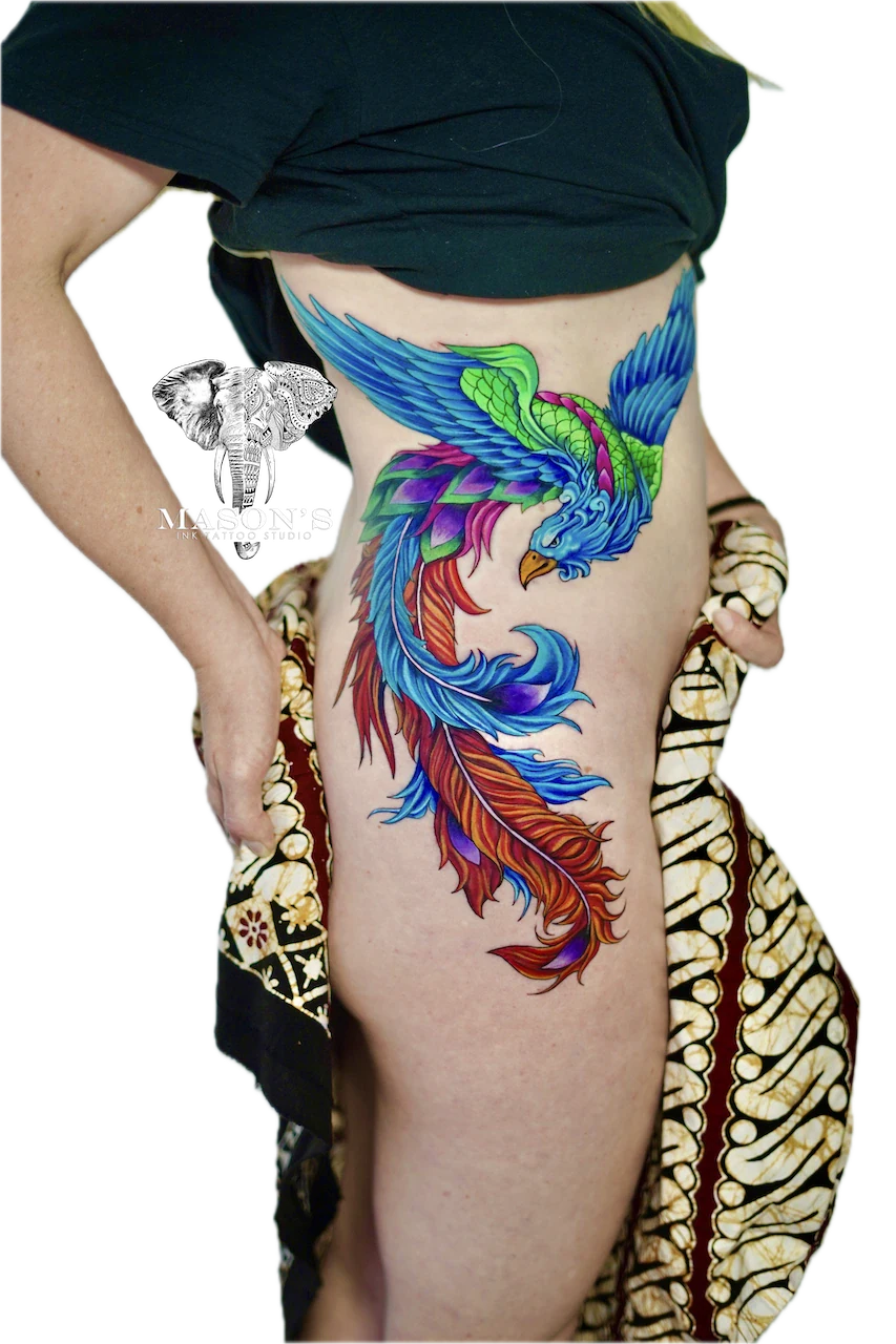 Vibrant Custom Phoenix Color Tattoo Design: a colorful phoenix with vibrant feathers on the stomach