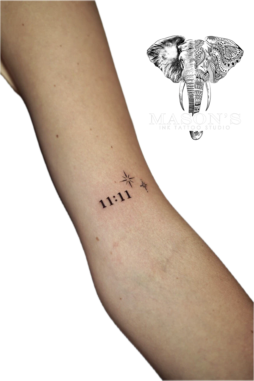 Fine Line Script and Star Tattoo Design: Minimalist tattoo of 11:11 with stars on the forearm