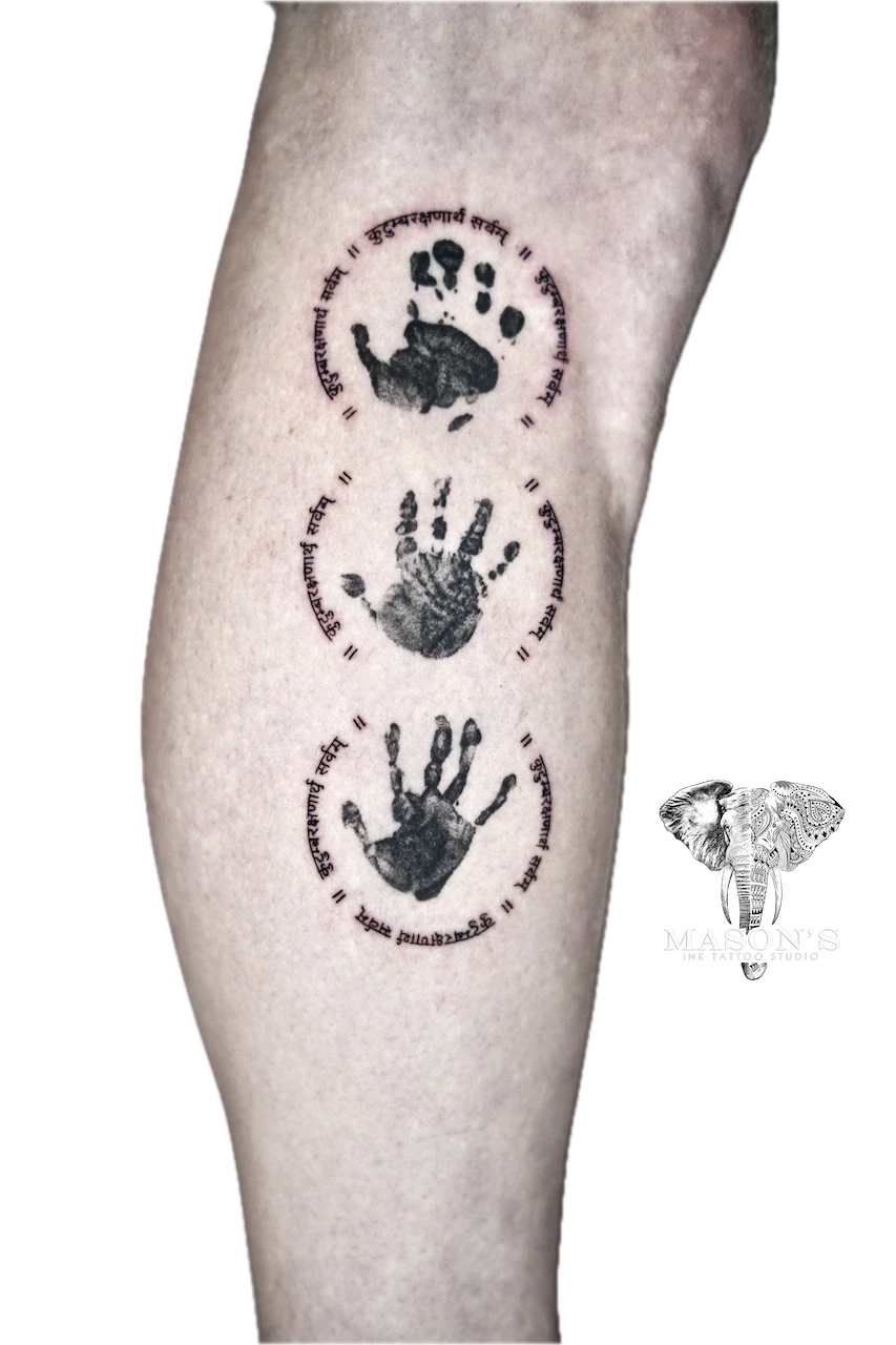 Fine Line Script Tattoo Design: Three handprints with script and dots on the calf