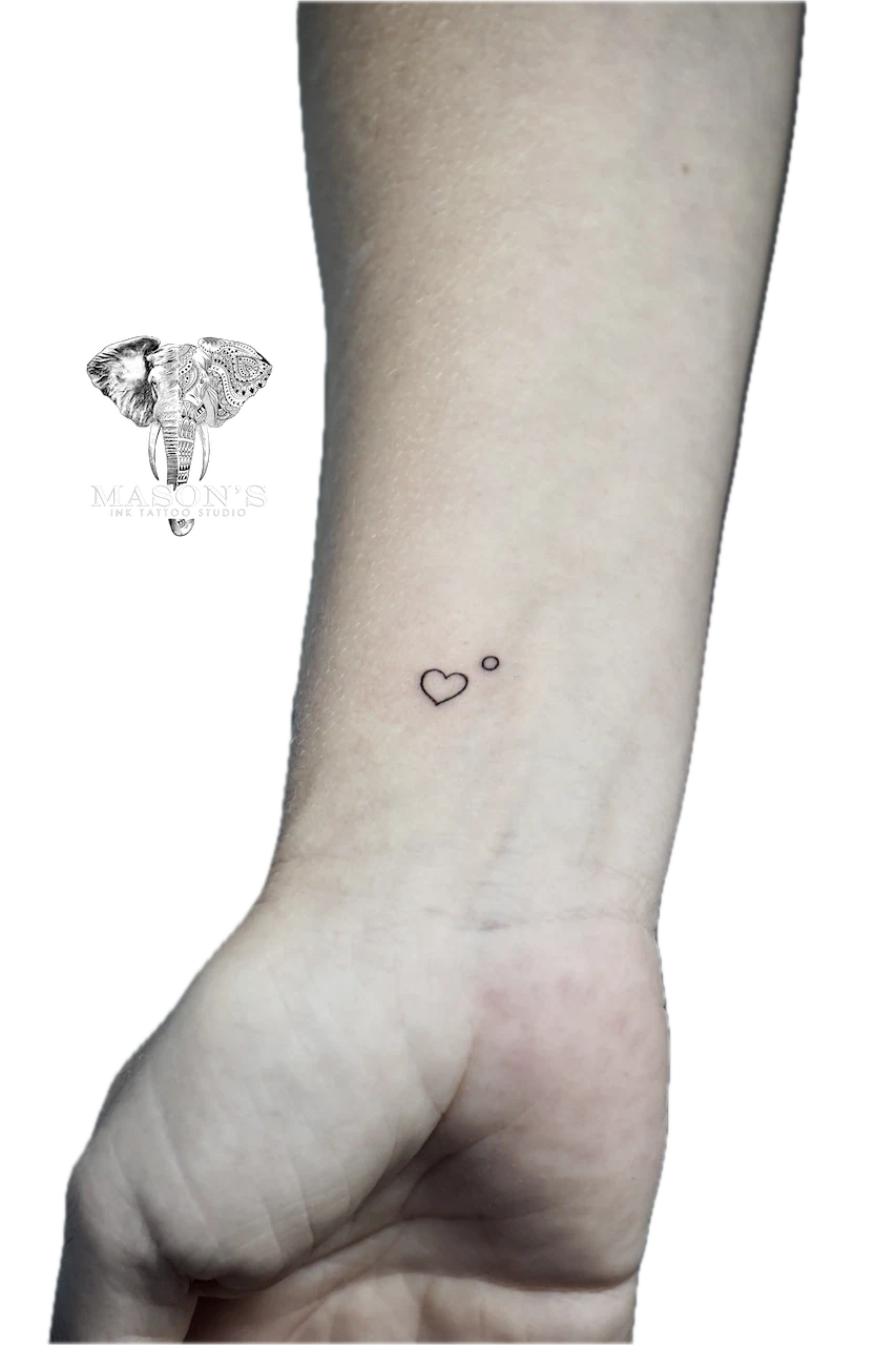 Fine Line Love Tattoo Design: Small heart and circle tattoo on the forearm