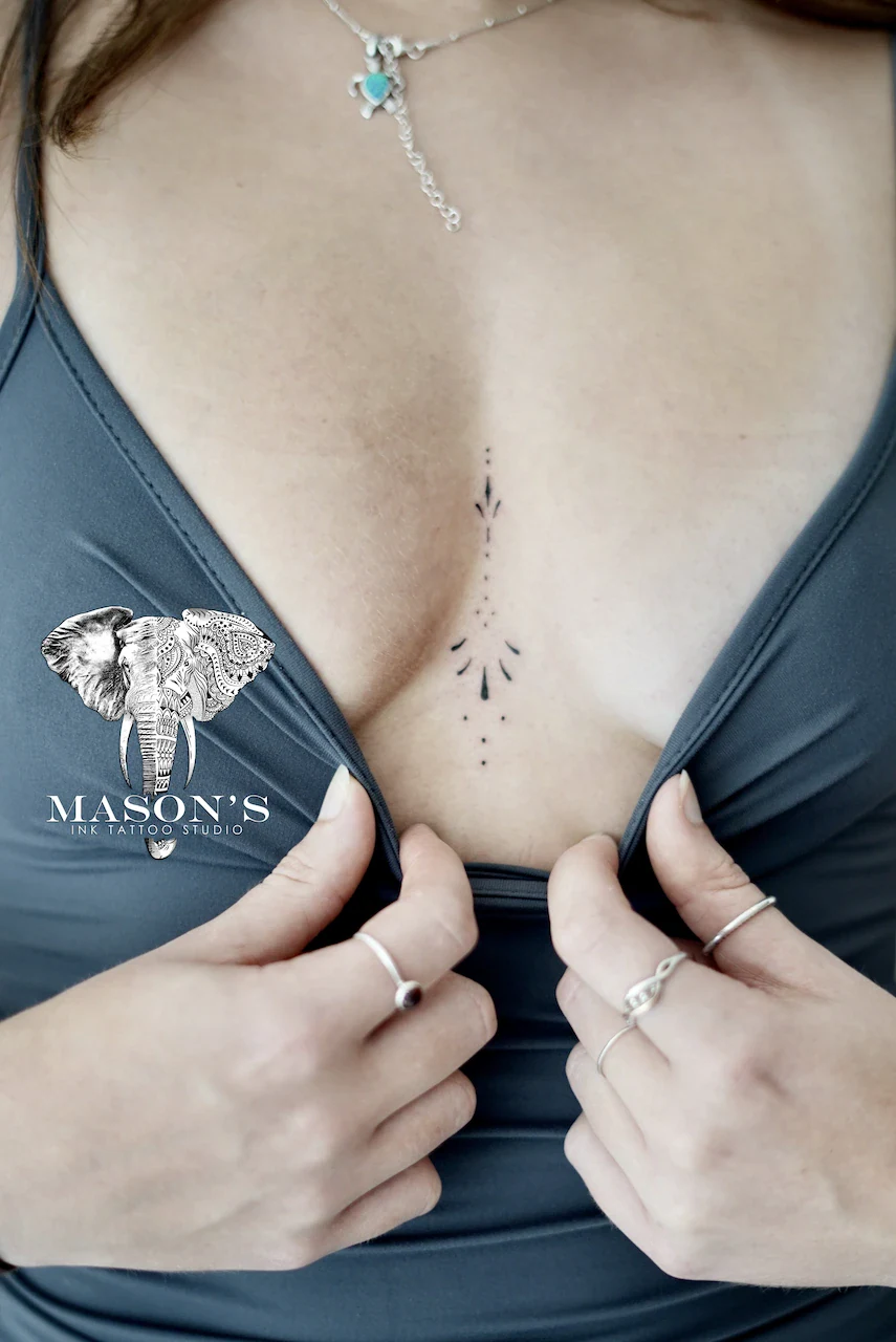 Fine Line Tattoo Design: Minimal geometric pattern on the sternum