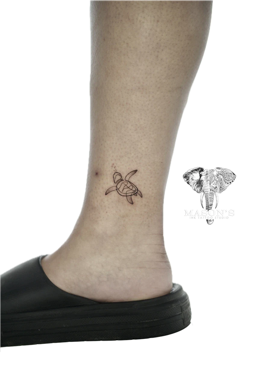 Fine Line Turtle Tattoo Design: Small minimalist turtle heart tattoo on the ankle
