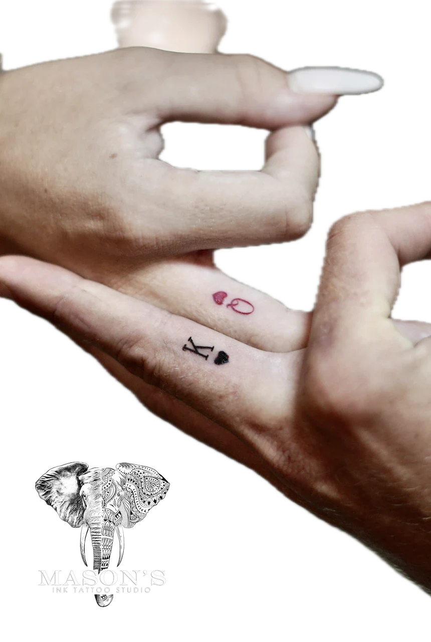 Fine Line Script Tattoo Design: Minimalist lettering and dots on the wrist