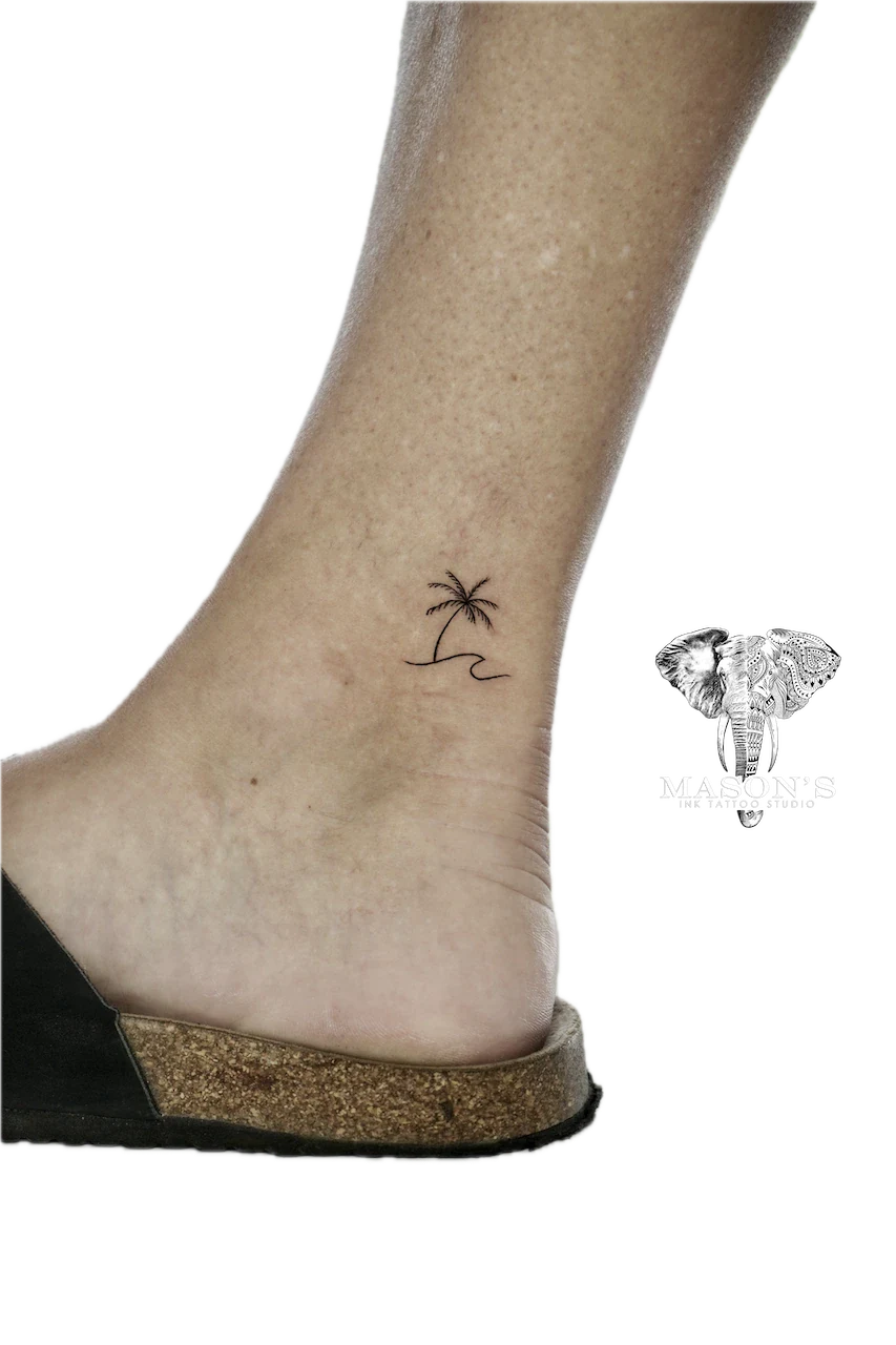 Fine Line Palm Tree Tattoo Design: a minimalist palm tree and wave on the ankle