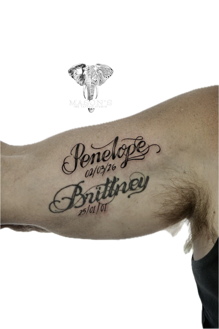 Delicate Fine Line Script Lettering Tattoo: a memorial tattoo with names and dates on the upper arm