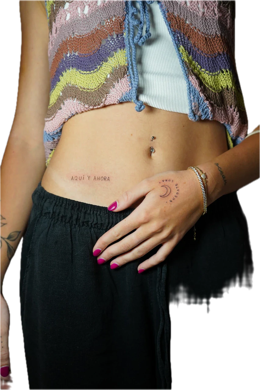 Delicate Fine Line Script Lettering Tattoo: Minimalist moon and stars with lettering on the stomach