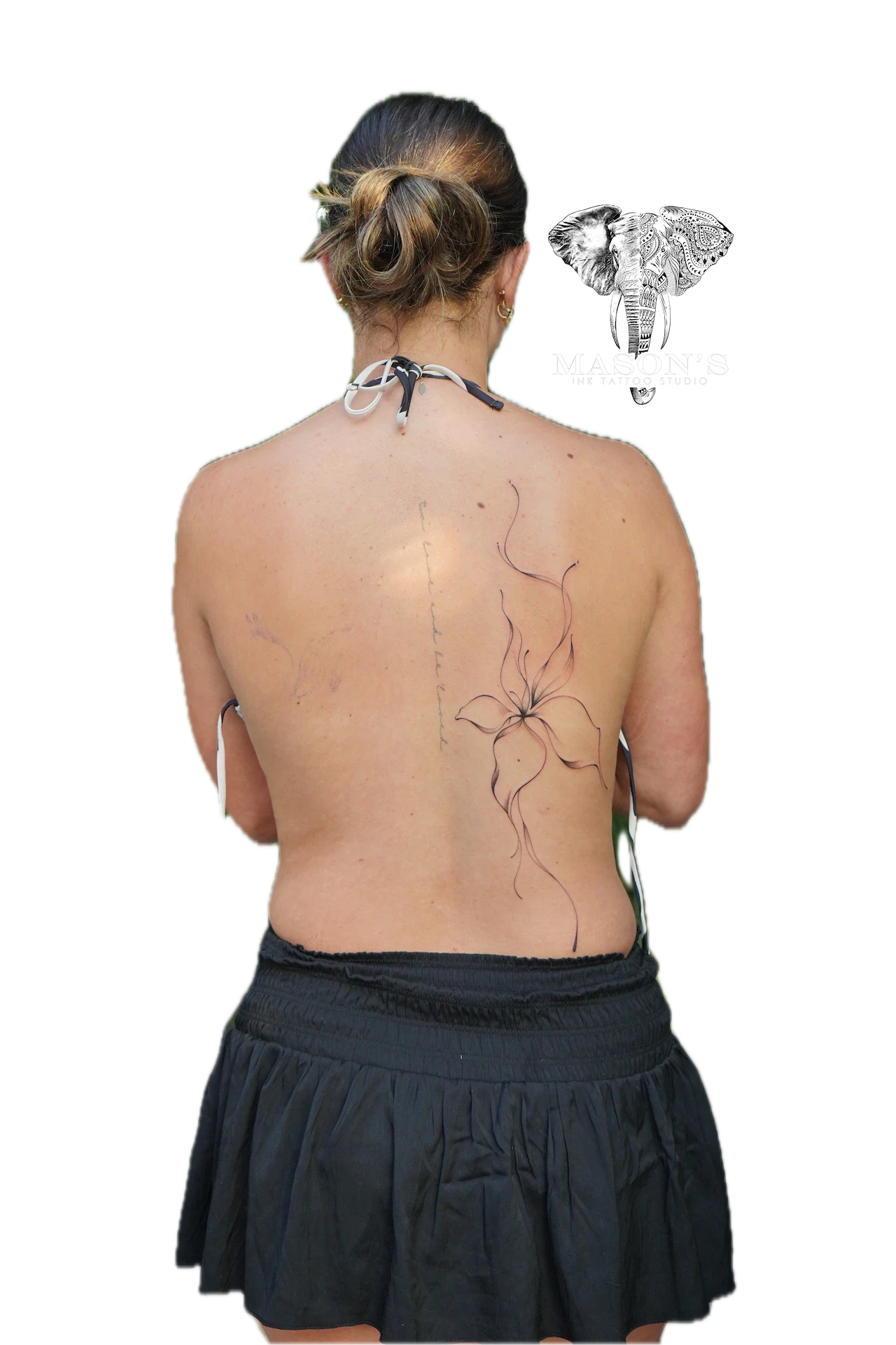 Floral Fineline Tattoo Style Design: a minimalist flower design on the back with vines and lines