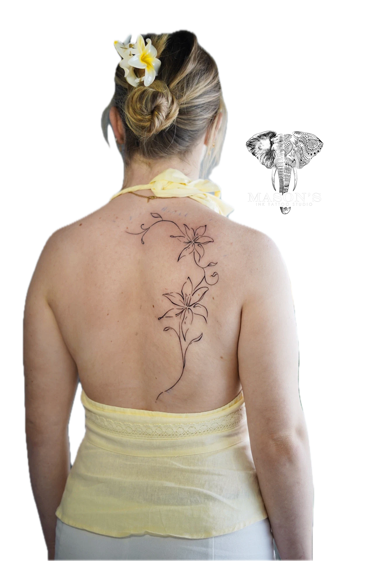 Floral Fineline Tattoo Design: a delicate floral vine with leaves and buds on the back