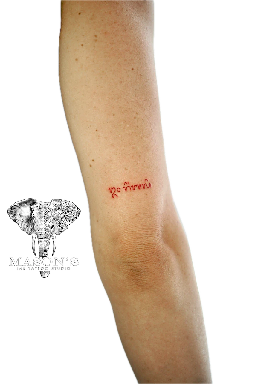 Fine Line Bali Script Red Ink Tattoo Design - Fineline tattoo by Mason's Ink Tattoo Studio, Bali