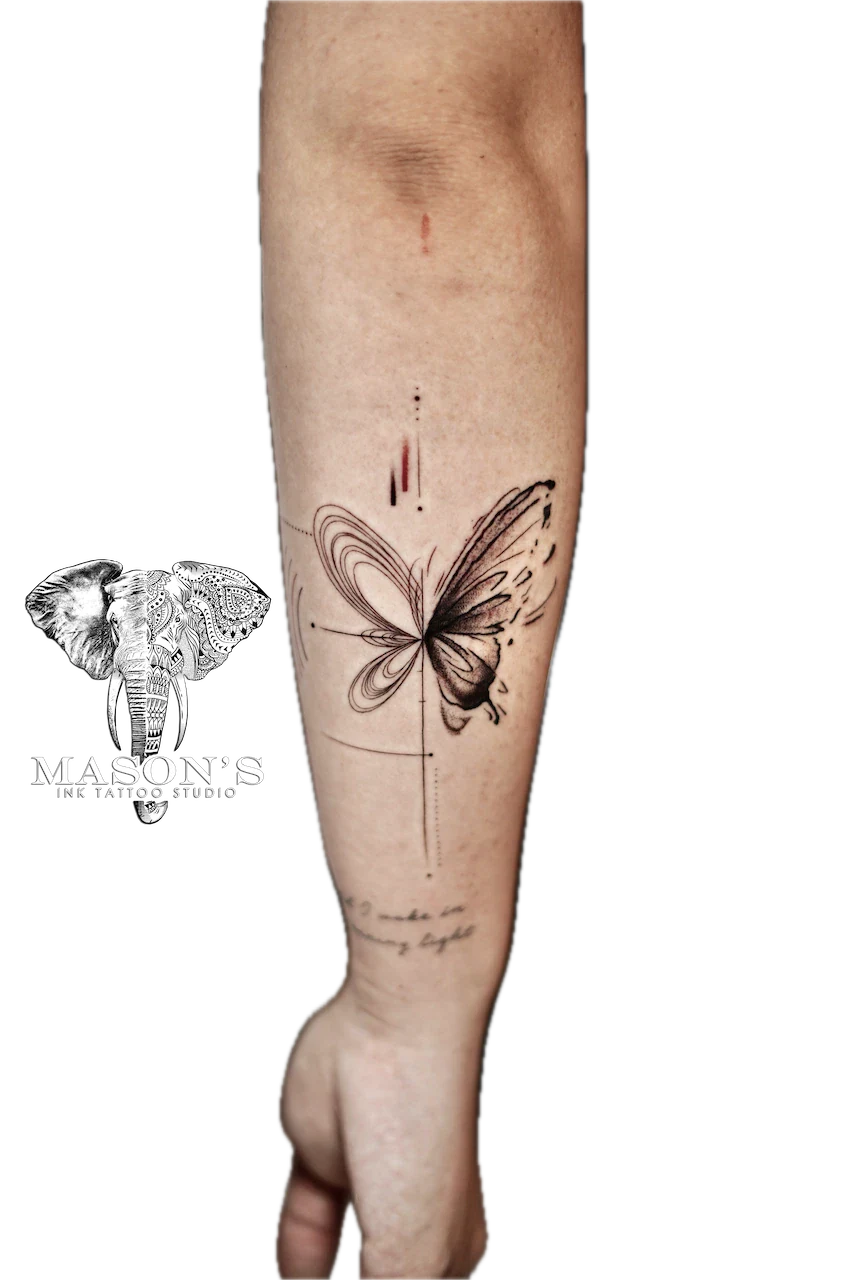 Fine Line Butterfly Tattoo Design: a butterfly with swirls and dots on a calf