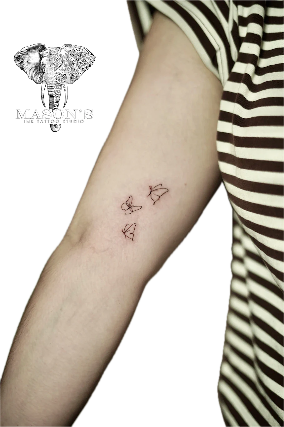 Fine Line Butterfly Tattoo Design: Three delicate butterflies on the forearm