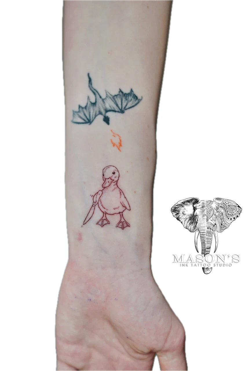 Fine Line Duck Tattoo Design: a small forearm tattoo of a bat, fish, and duck with a stick