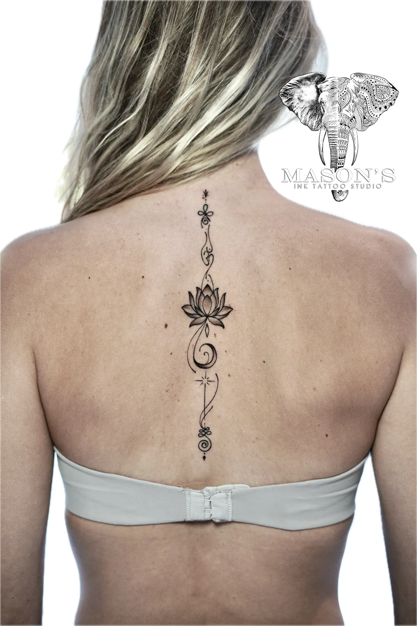 Fine Line Floral Back Tattoo Design: a minimalist lotus flower tattoo with swirls and stars on the spine