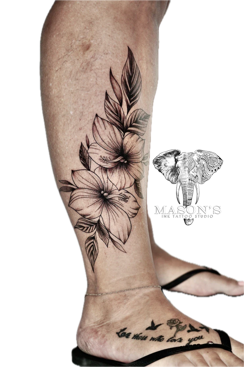 Fine Line Floral Flower Tattoo Design: Large floral tattoo with birds and lettering on the calf