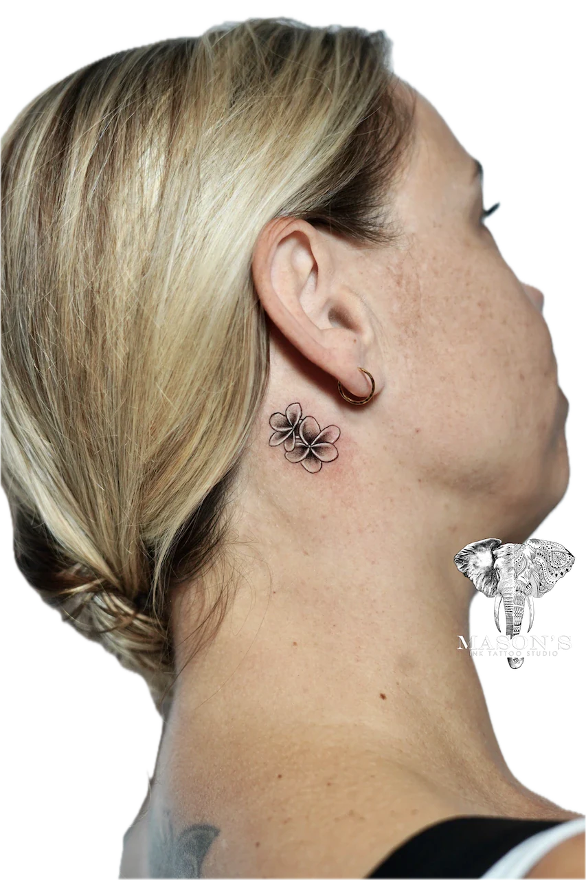 Fine Line Floral Flower Tattoo Design: Small delicate flower tattoo behind the ear