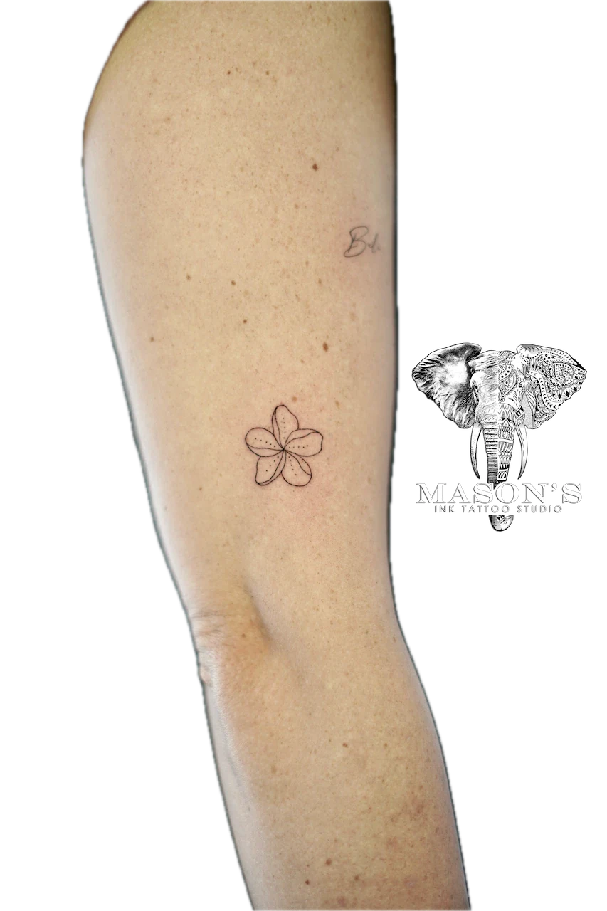 Fine Line Floral Flower Tattoo Design: a small, minimalist flower tattoo on the calf