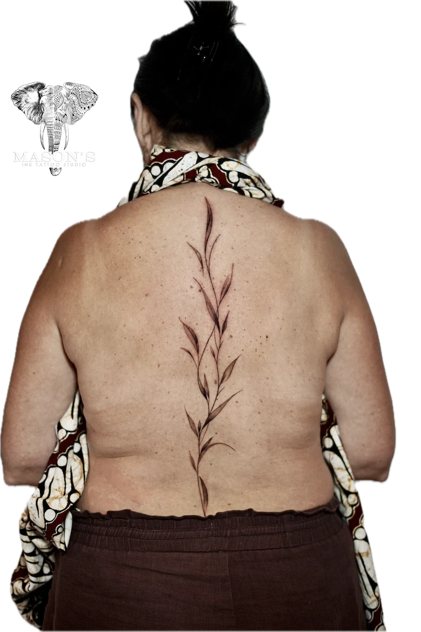Fine Line Floral Leaf Back Tattoo Design by Mason's Ink Tattoo Studio, Bali