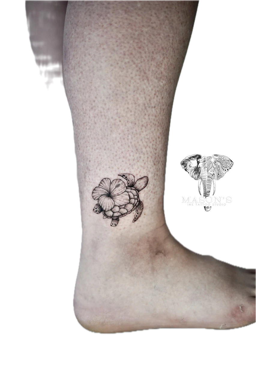 Fine Line Floral Turtle Tattoo Design: a small turtle with a flower on its shell on the calf