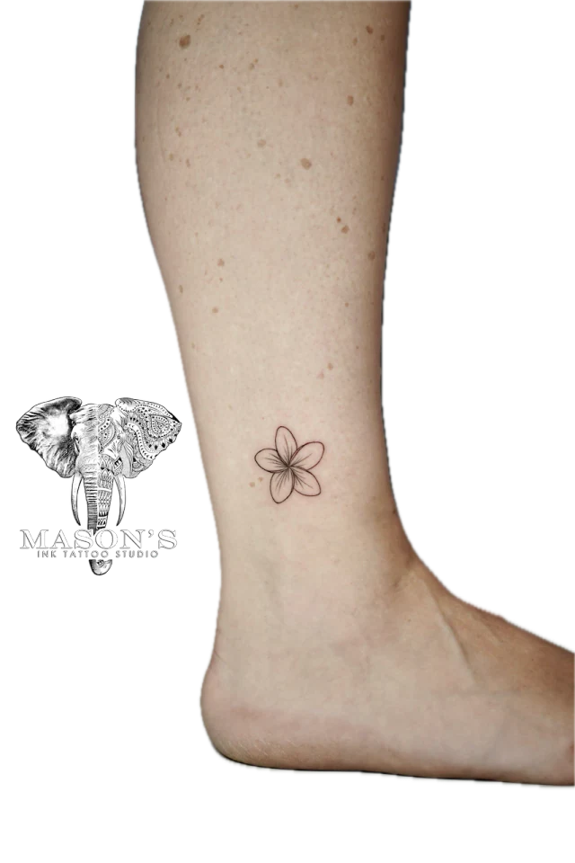Fine Line Flower Tattoo: Small minimalist flower tattoo on the calf