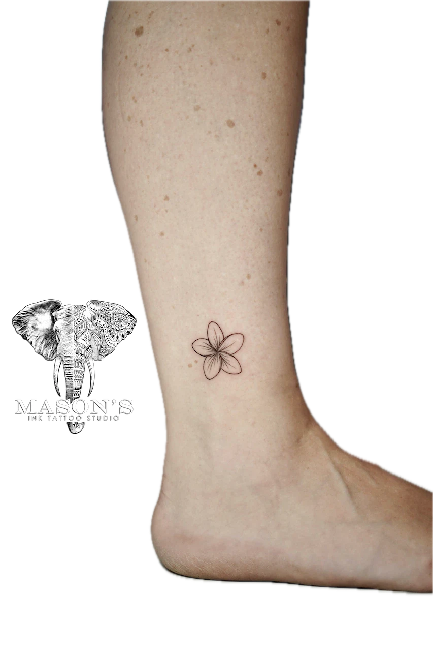 Fine Line Flower Tattoo: Small minimalist flower tattoo on the calf