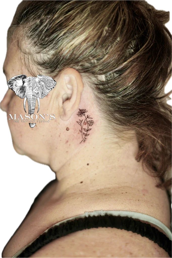 Fine Line Flower Tattoo Design: a delicate plant with flowers behind the ear