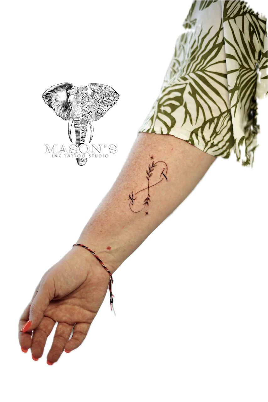 Fine Line Infinity Floral Script Tattoo Design - Fineline tattoo by Mason's Ink Tattoo Studio, Bali