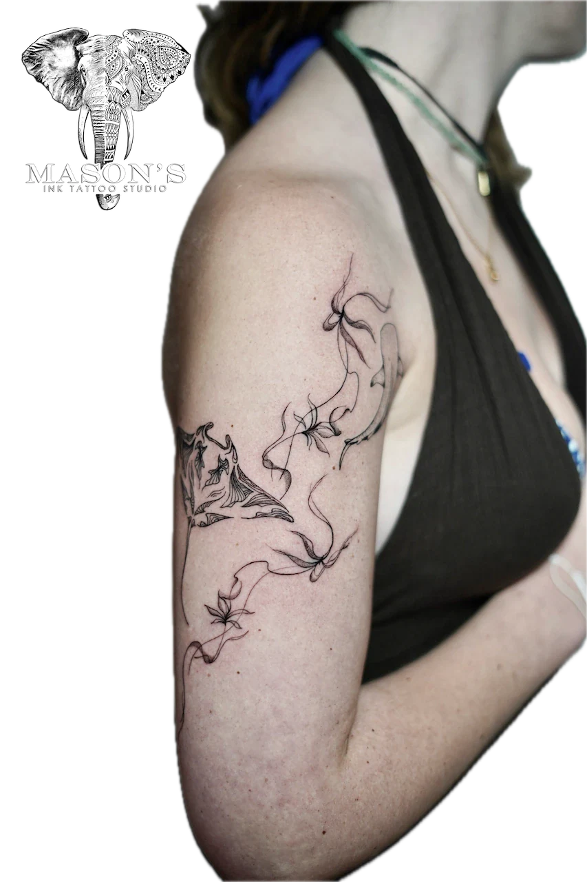 Fine Line Manta Ray Tattoo Design: a delicate black and grey floral vine tattoo on the upper arm