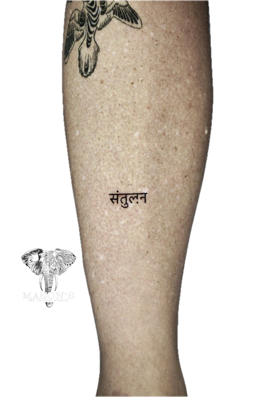 Fine Line Om Symbol Tattoo Design: a bird and script lettering on a calf