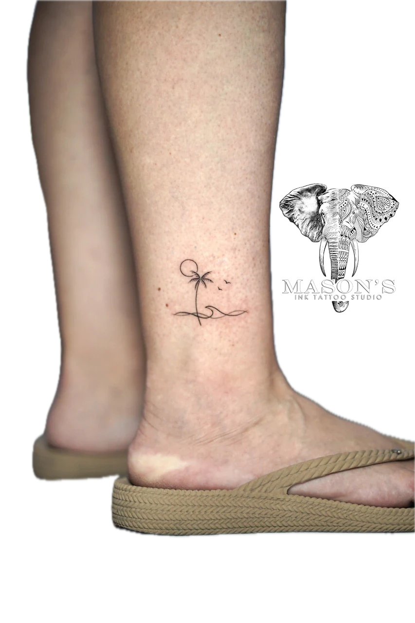 Fine Line Palm Tree and Wave Tattoo Design: a minimalist palm tree and wave tattoo on a calf