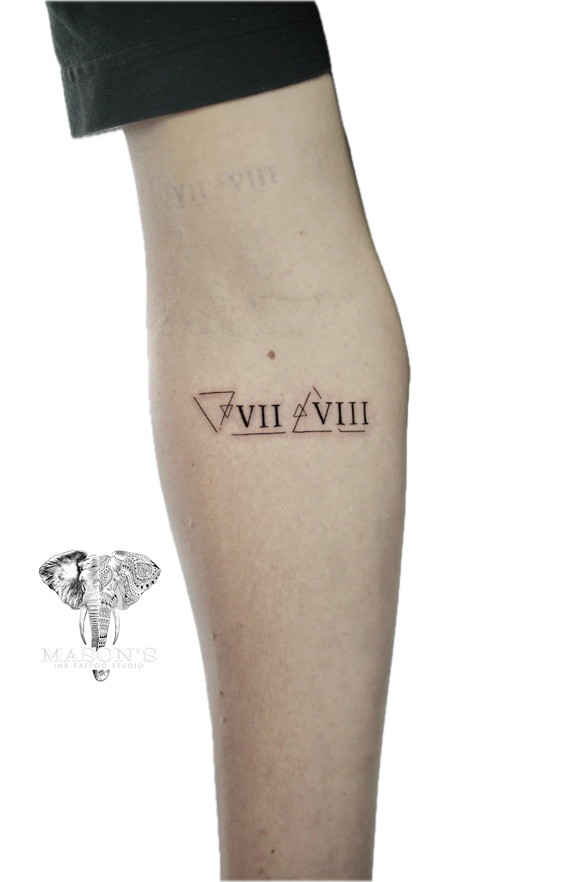Fine Line Roman Script Tattoo Design: Minimal geometric pattern with Roman numerals on calf