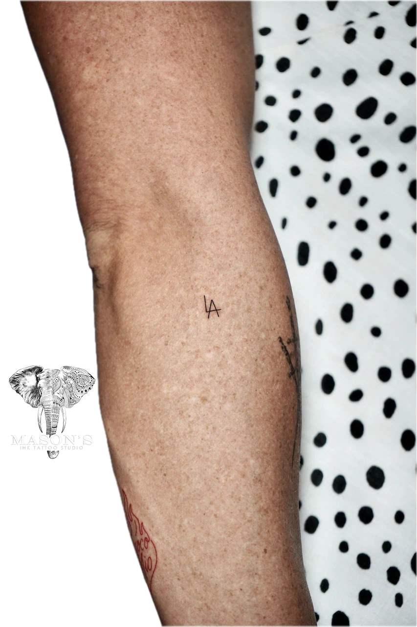 Fine Line Script Tattoo Design: Minimalist tree and bird with lettering on the forearm