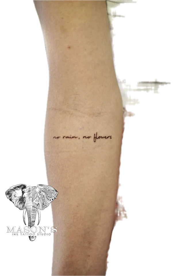 Fine Line Script Tattoo: Minimal script lettering on the calf