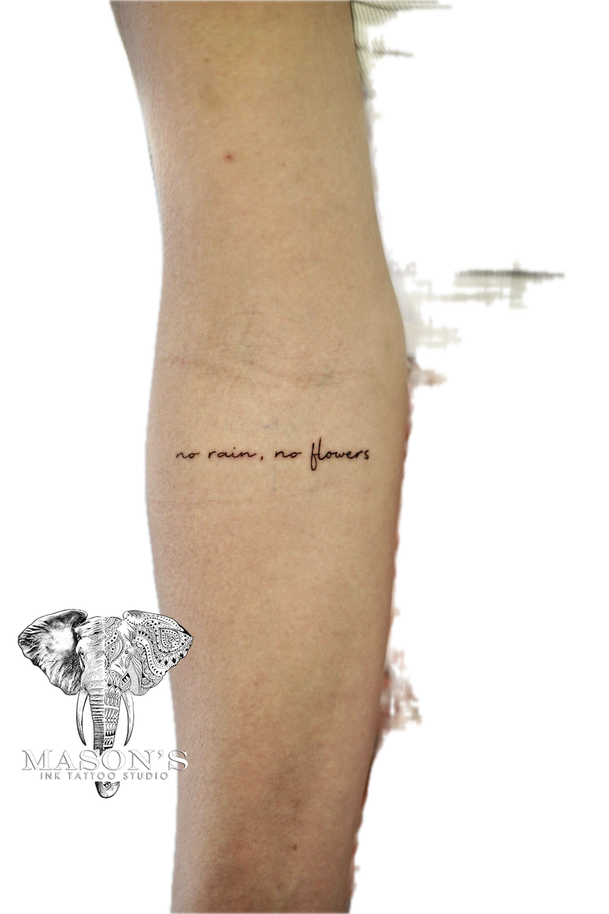 Fine Line Script Tattoo: Minimal script lettering on the calf