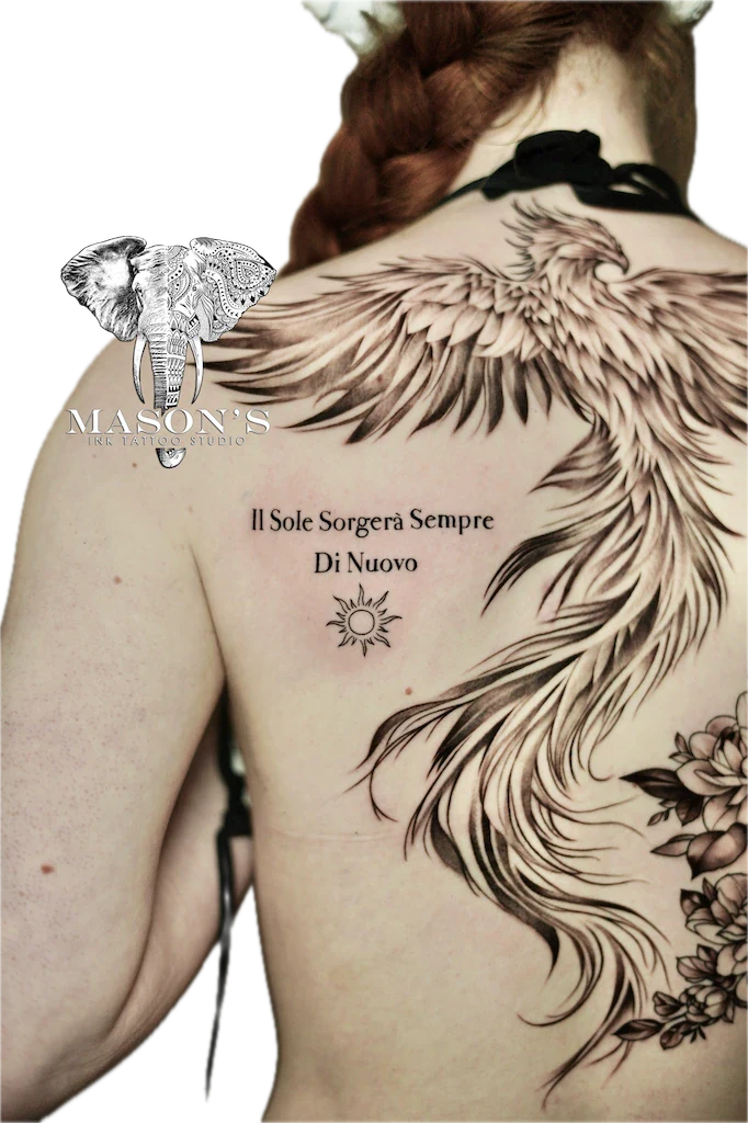 Fine Line Script Tattoo Design: Large back tattoo of wings with an elephant and sun
