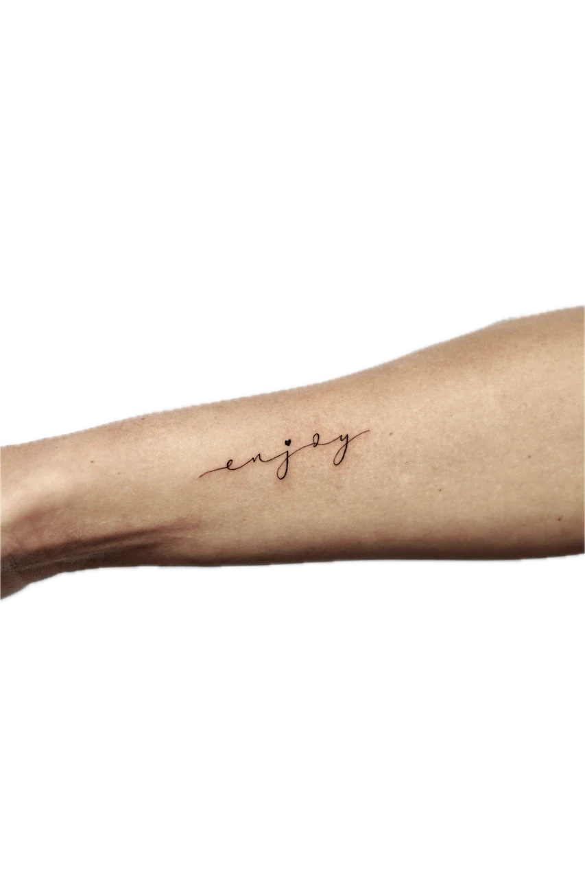 Fine Line Script Tattoo Design: Small forearm tattoo of the word 'enjoy' in cursive