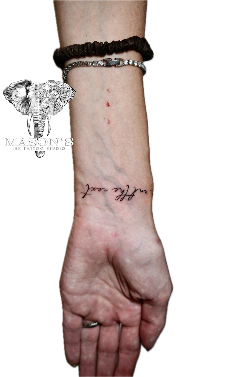 Fine Line Script Tattoo Design: Small black and grey lettering on the forearm