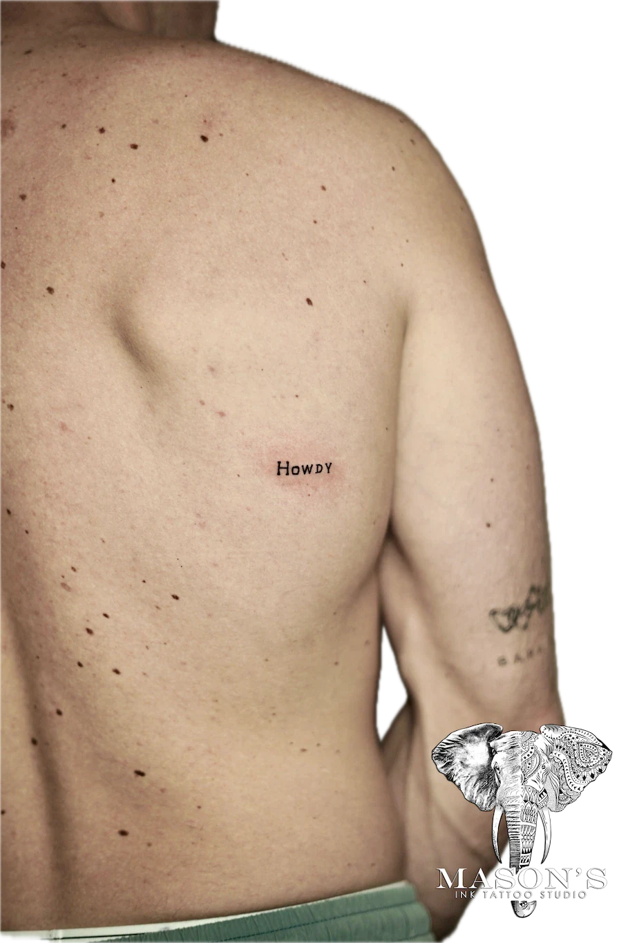 Fine Line Script Tattoo Design: Small minimalist lettering tattoo on the chest
