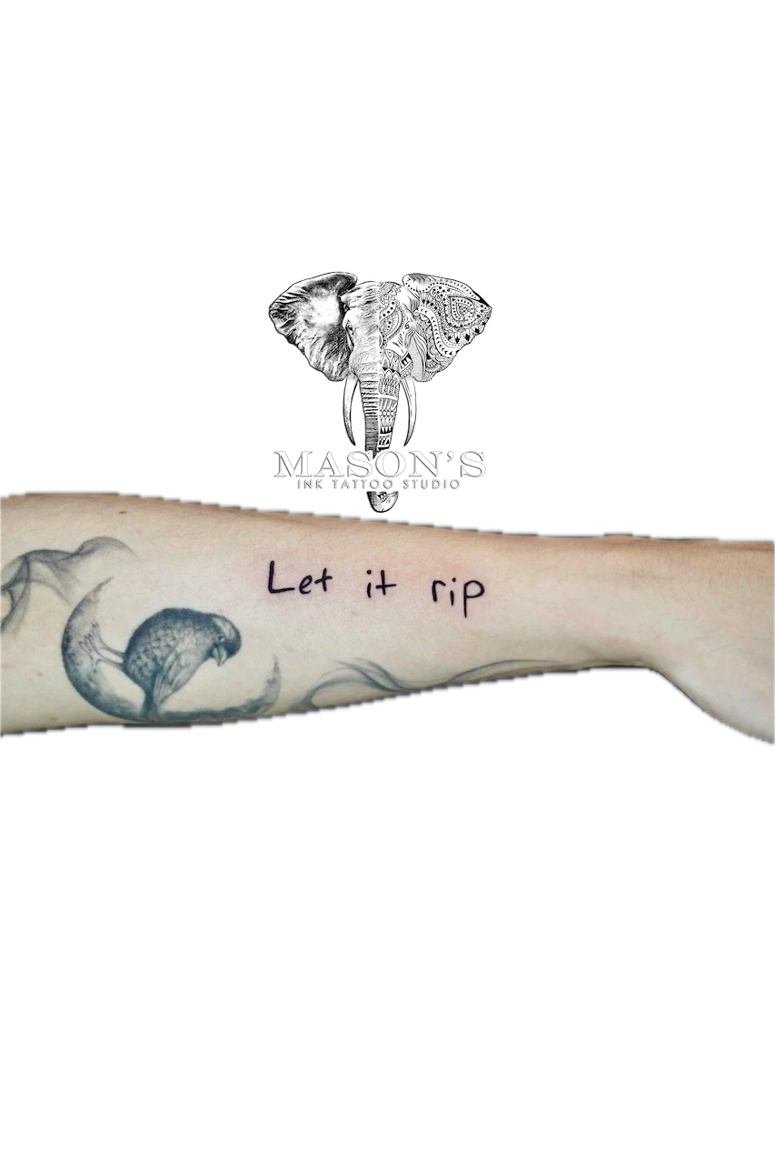 Fine Line Script Tattoo Design: a minimal black and grey forearm tattoo of a parrot and fish with lettering