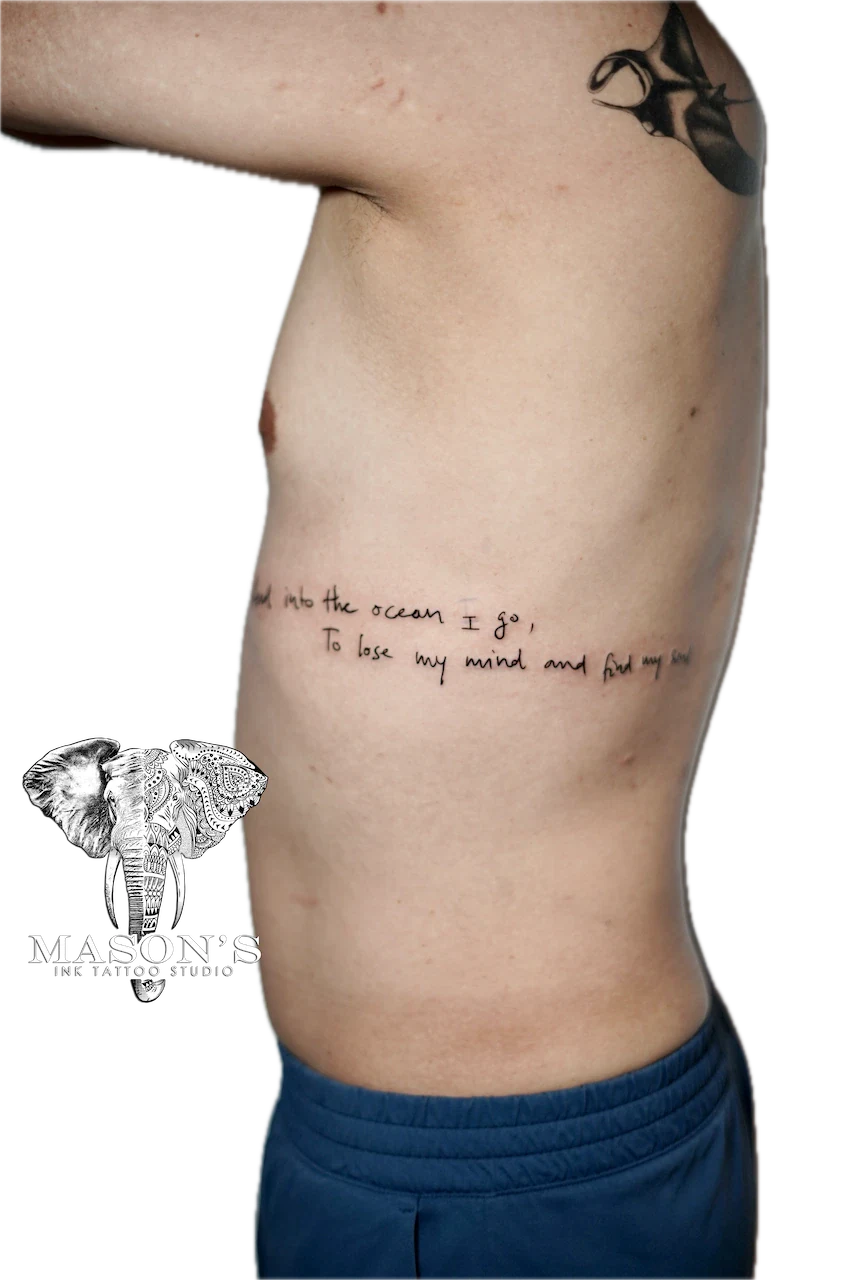Fine Line Script Tattoo Design: Minimal script tattoo of ocean-themed lettering on the stomach