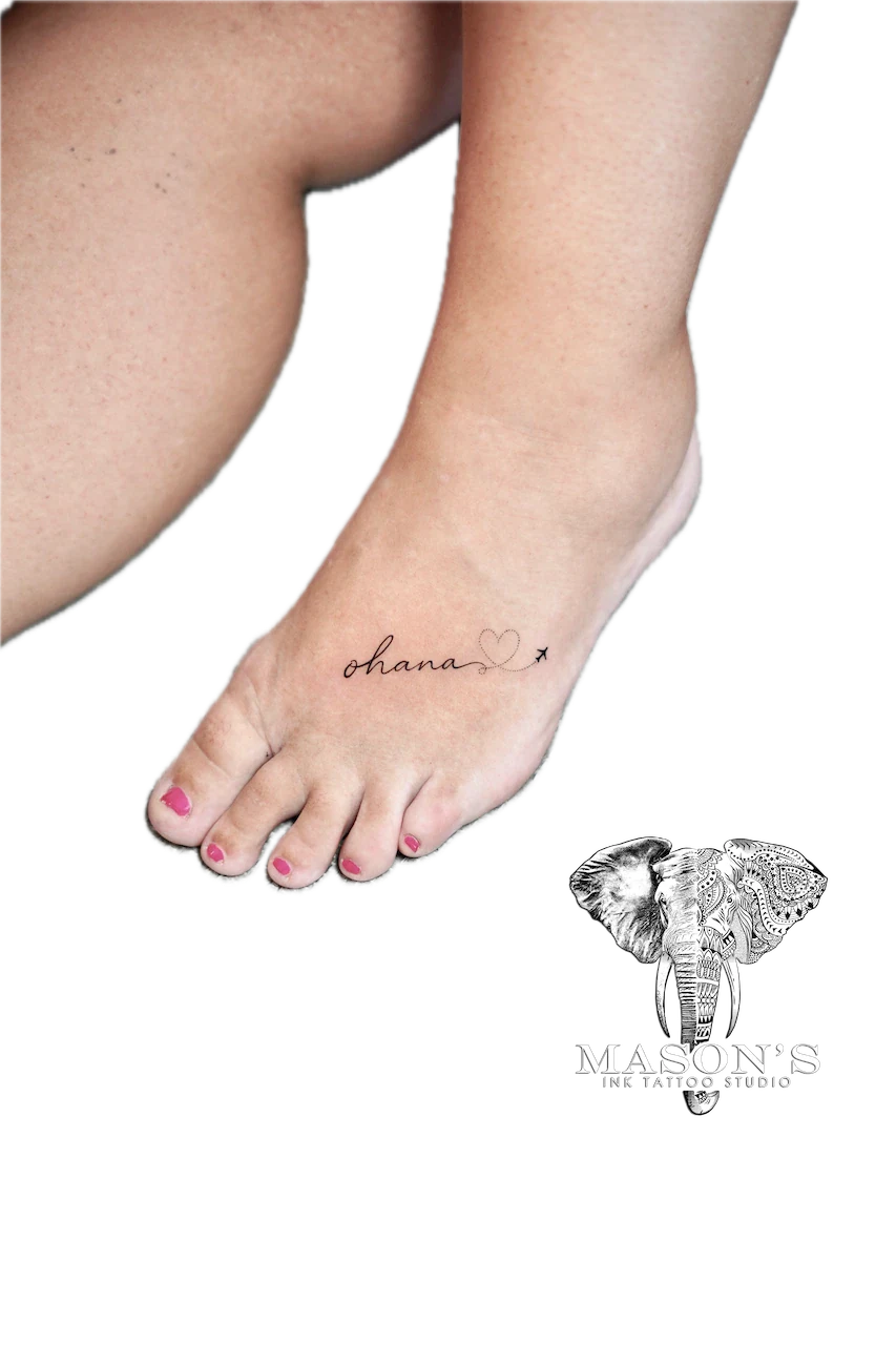 Fine Line Script Tattoo Design: Small foot tattoo of the word 'ohana' with a heart and arrow