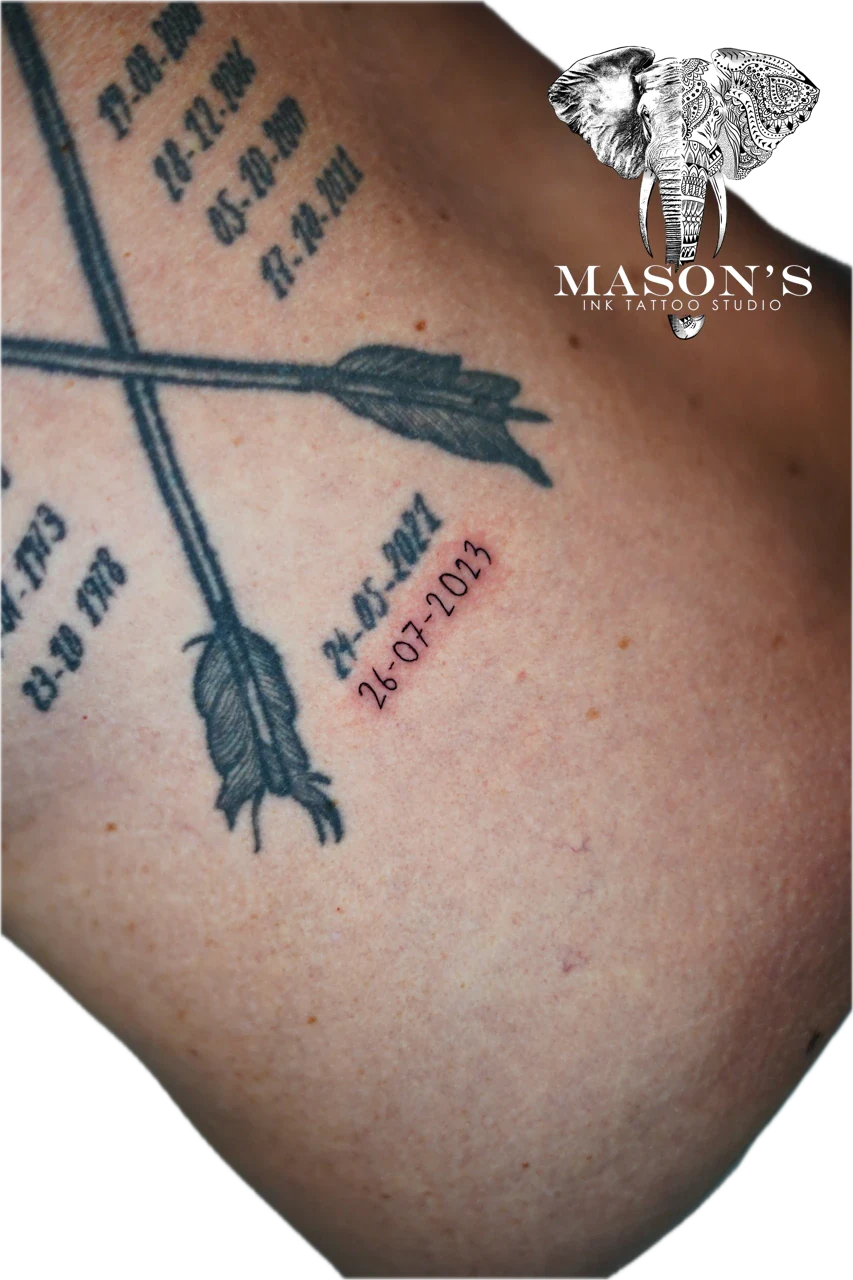 Fine Line Script Tattoo Design: Tattoo of arrows and dates with minimalistic design
