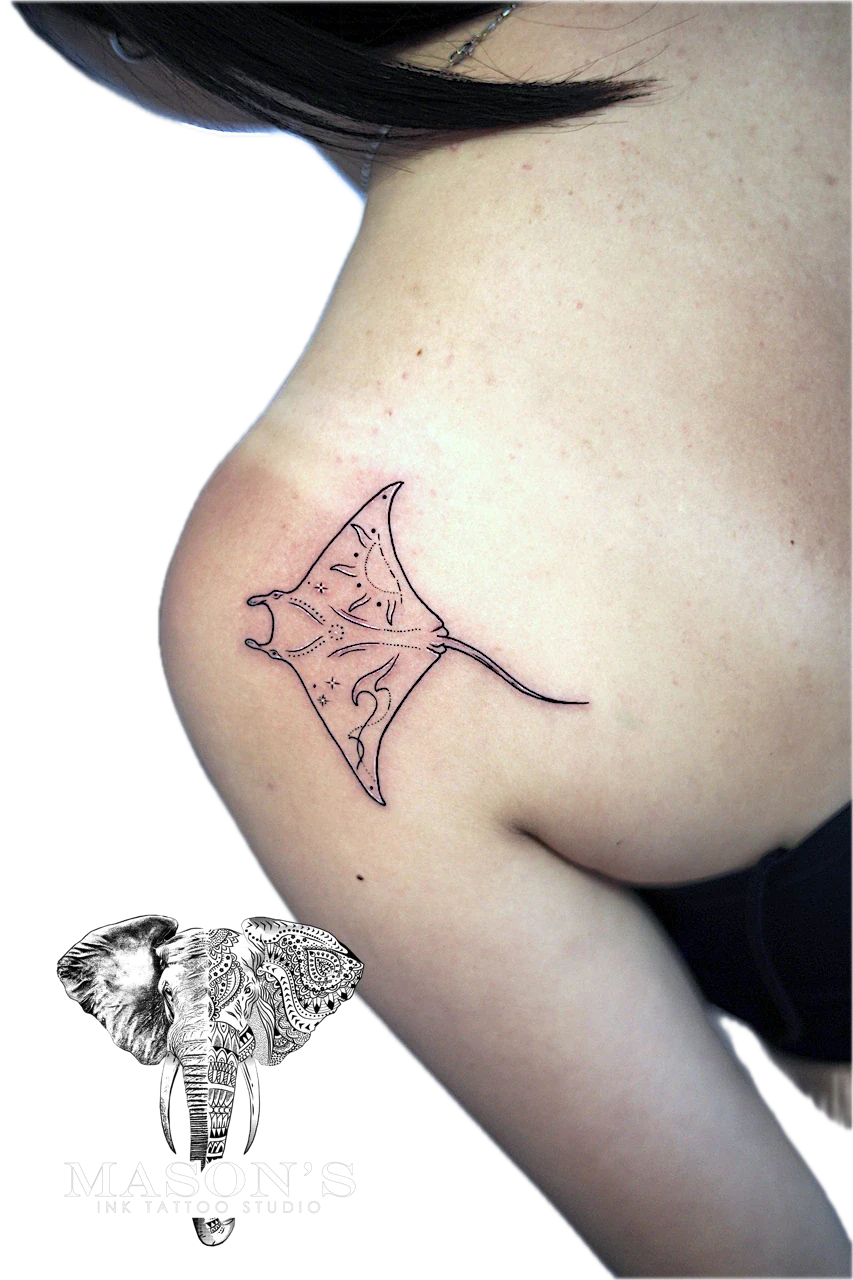 Fine Line Stingray Tattoo Design: a small manta ray tattoo on the hip with intricate details