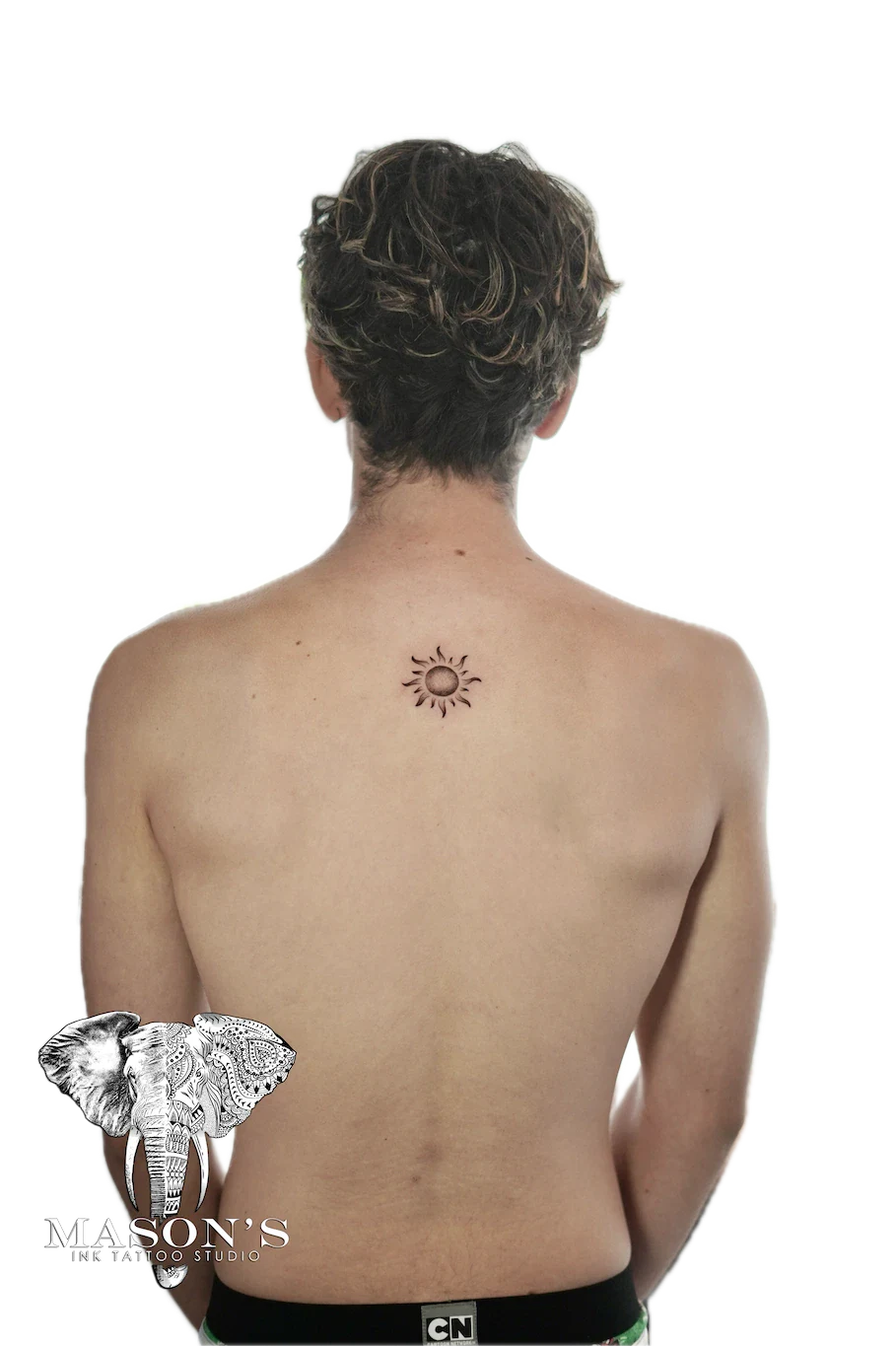 Fine Line Sun Tattoo Design: Small sun tattoo with rays on the upper back