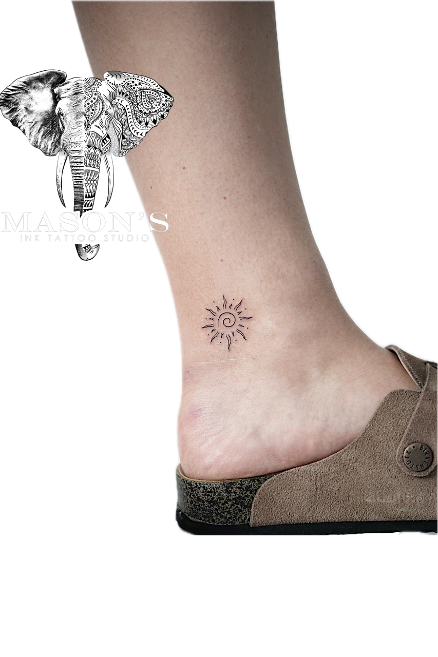 Fine Line Sun Tattoo Design: a minimal sun and star geometric pattern on the ankle