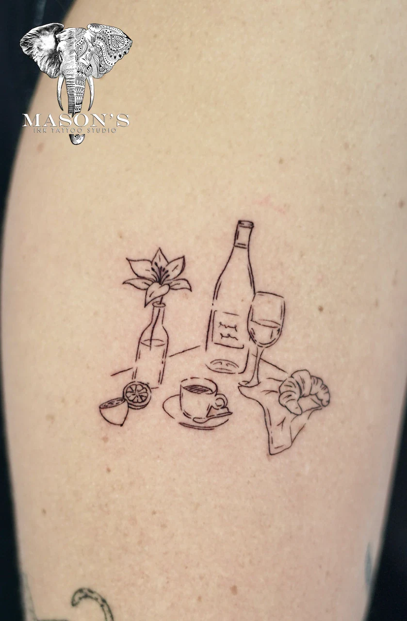 Fine Line Symbol Tattoo Design: a minimalist tattoo of a wine bottle, glass, and bread